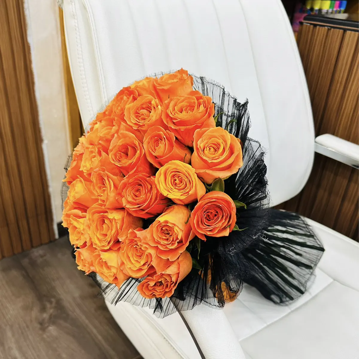 Orange Roses in Black Wrap of orange roses in black wrapping
