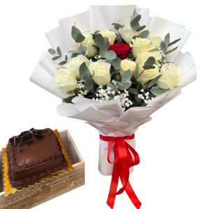 White and red rose bouquet with a chocolate cake in a wooden crate